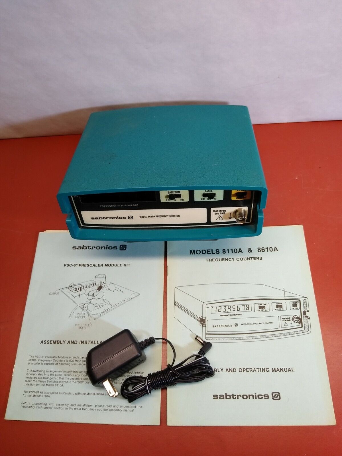 SABTRONICS 8110A FREQUENCY COUNTER WITH ADAPTER AND MANUAL-USED SEE DESCRIPTION